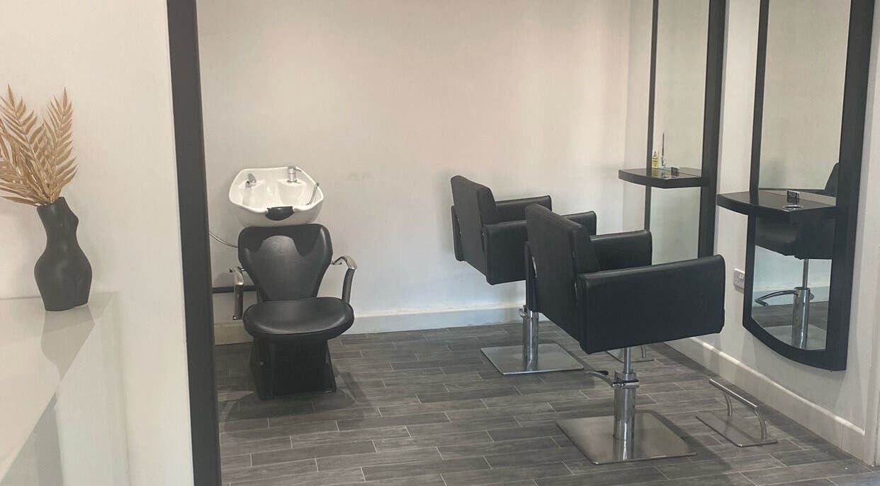 Modern hair styling chairs and mirrors at More Than Aesthetics, Parkgate, England, GB.