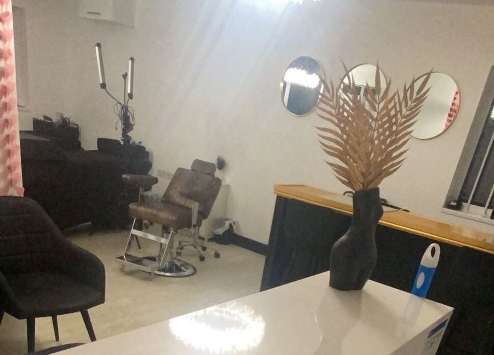 Modern salon interior at More Than Aesthetics, Parkgate, England, GB. Features stylish chairs and decorative elements.