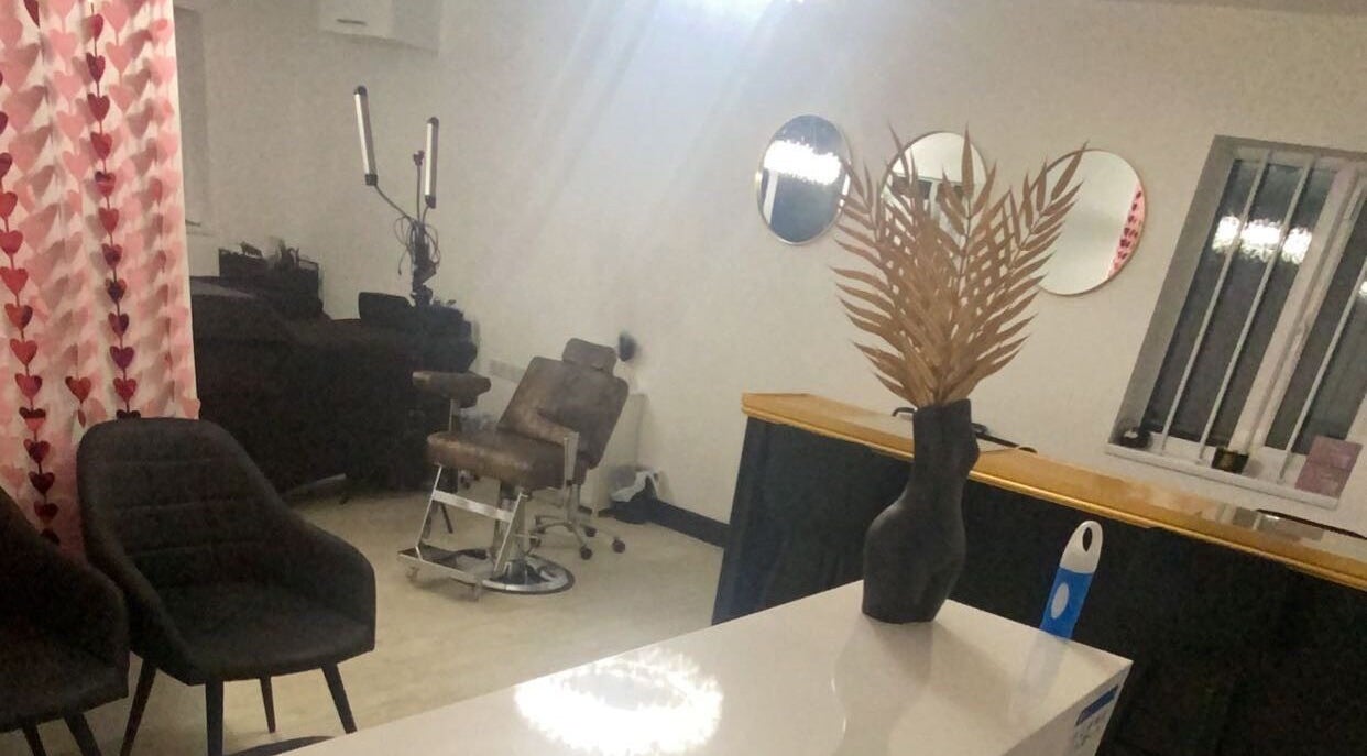 Modern salon interior at More Than Aesthetics, Parkgate, England, GB. Features stylish chairs and decorative elements.