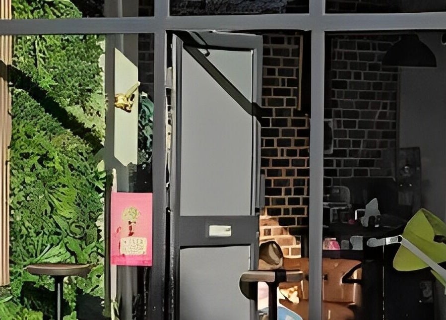 Entrance to The Man Cave Barbershop in Northampton, England, GB features a stylish modern design.