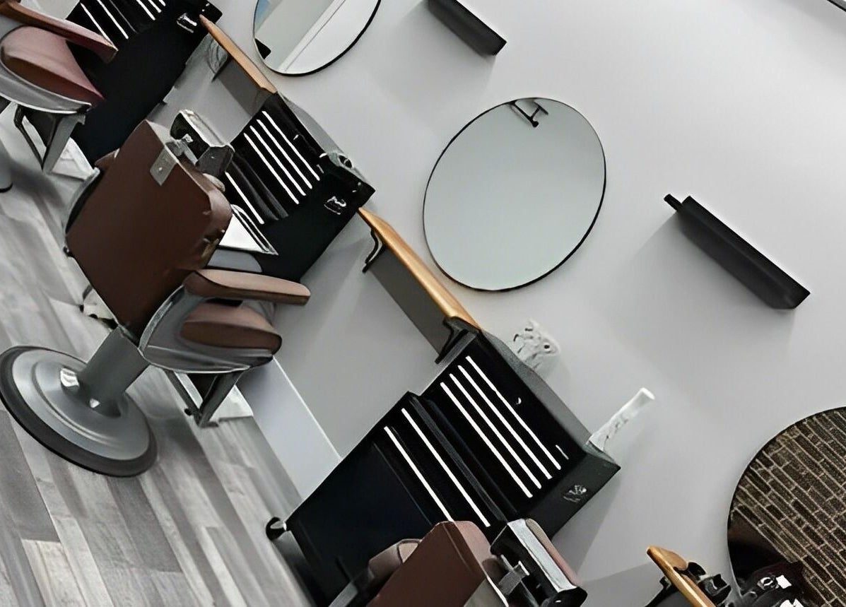 Modern barber chairs at The Man Cave Barbershop, Northampton, England, GB.