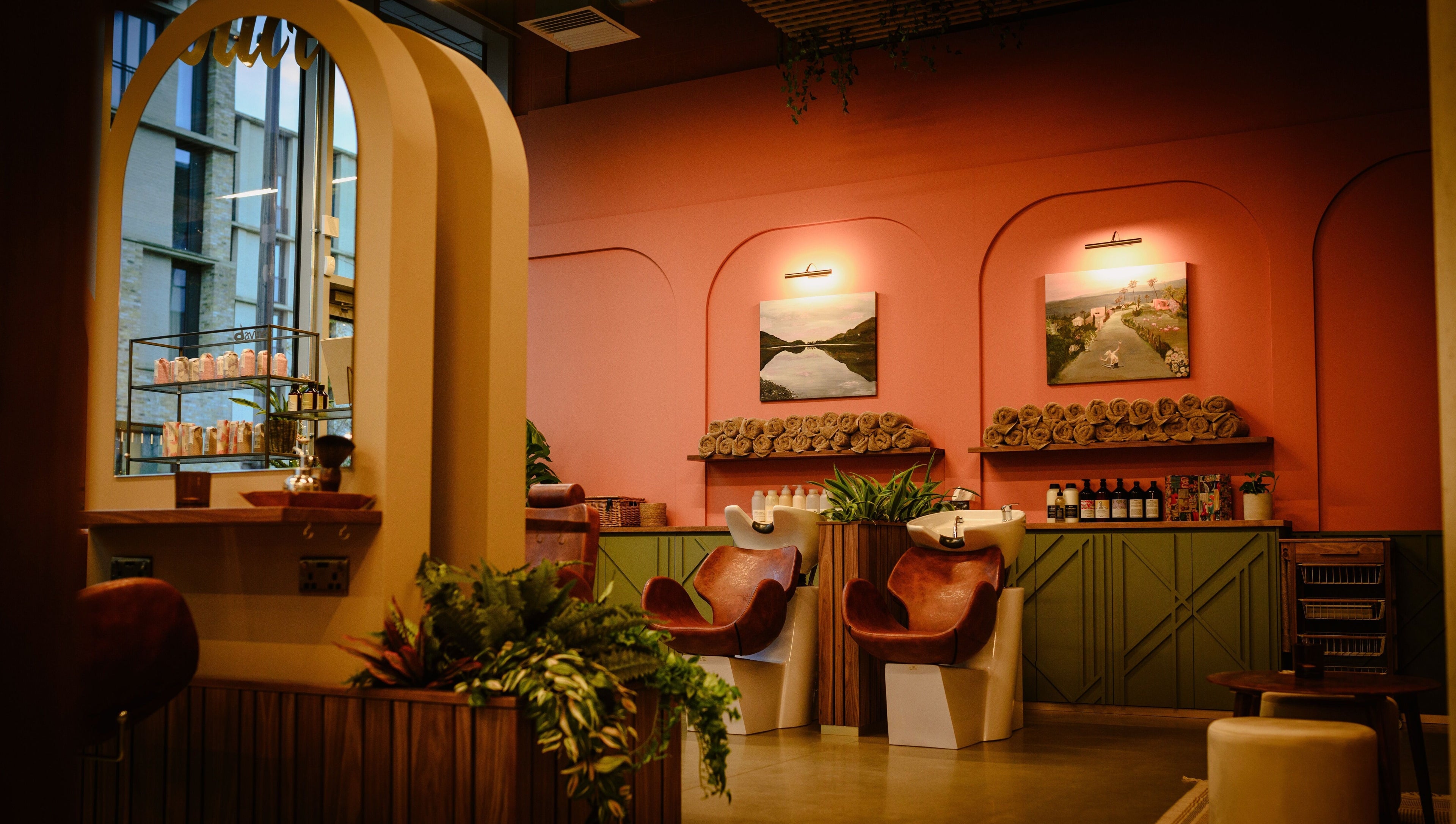 Douce Eddington salon's calming interior in Cambridge, England, GB with stylish chairs and decor.