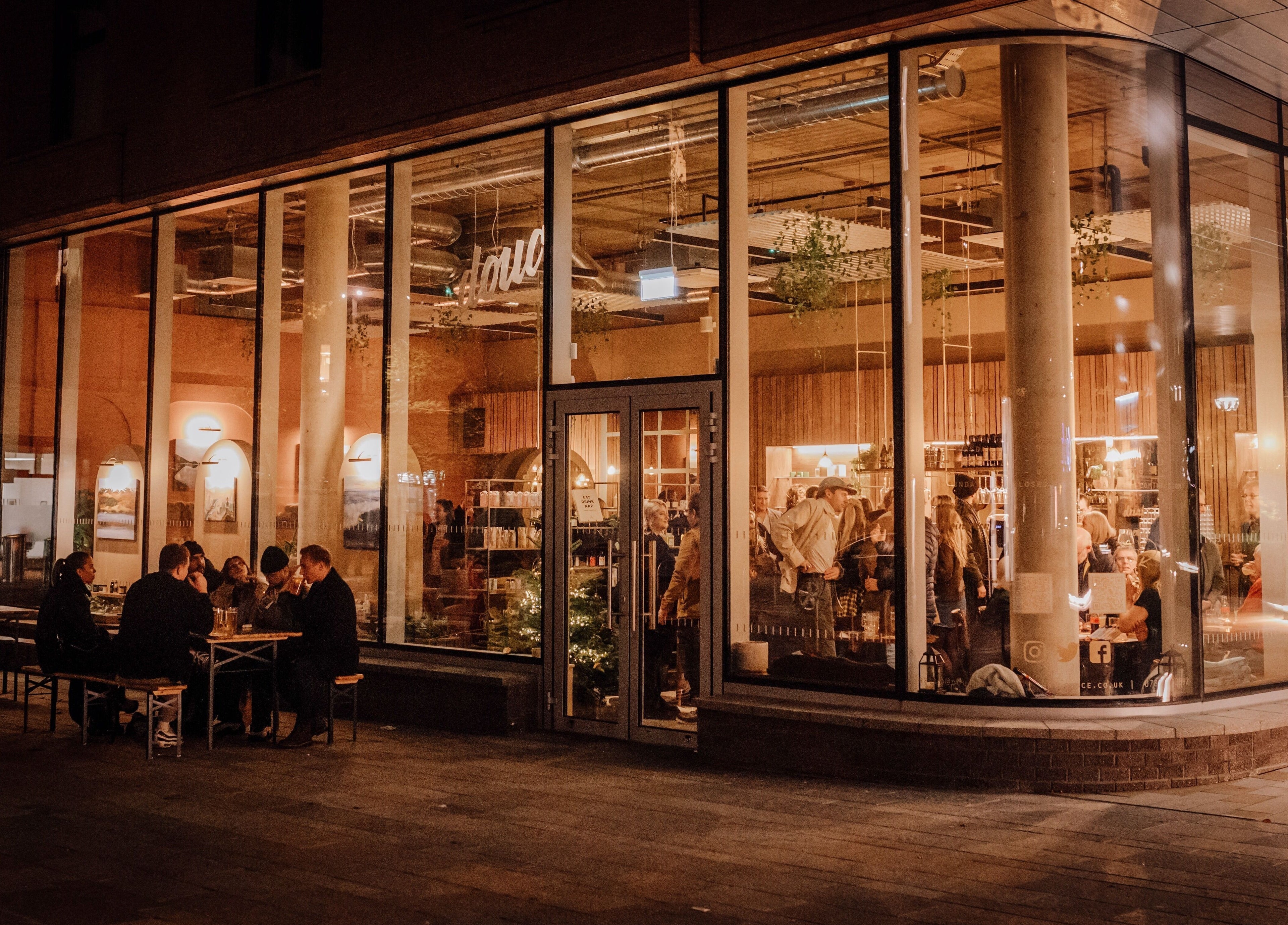 Evening view of Douce Eddington venue in Cambridge, England, GB, showcasing a cozy and lively atmosphere.