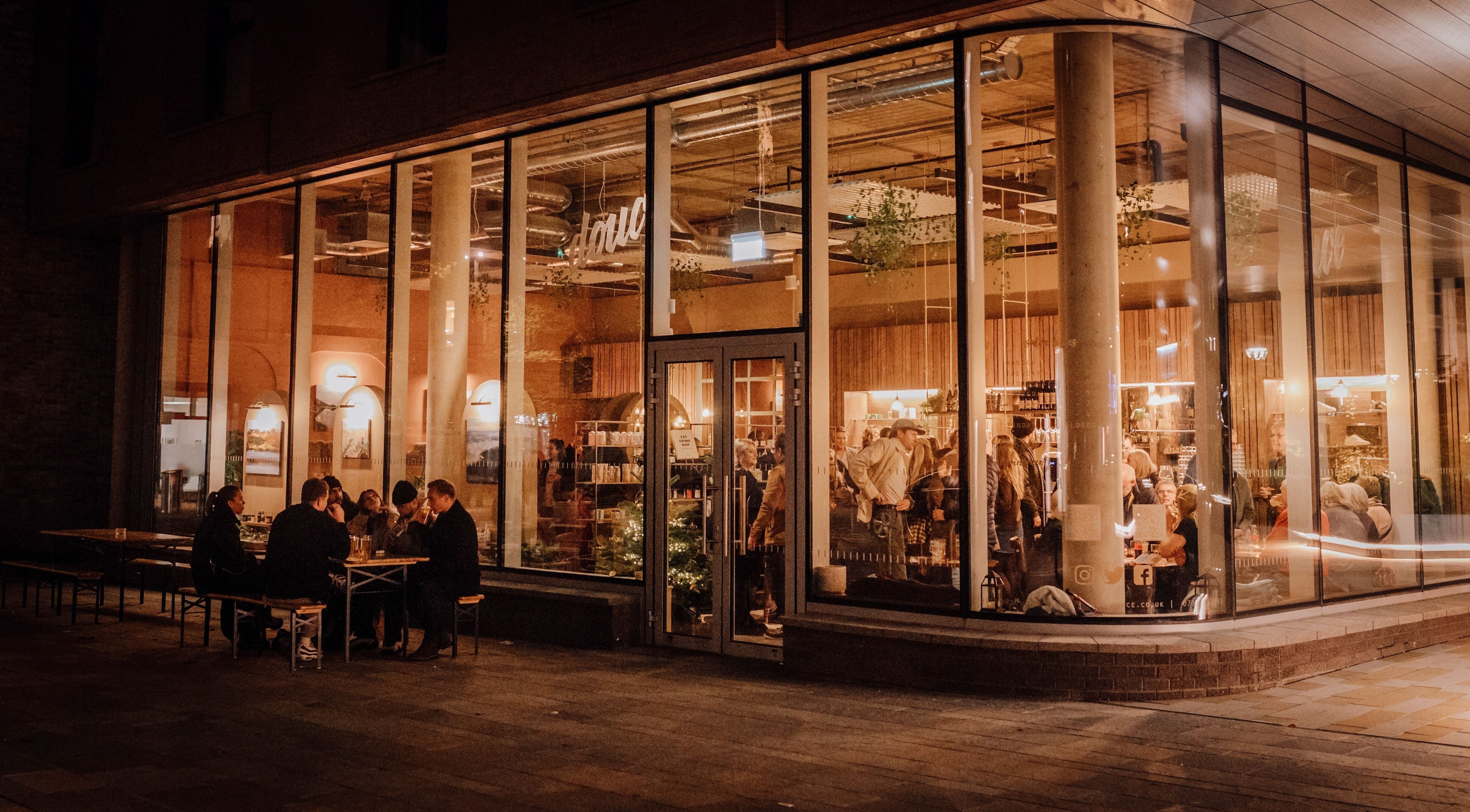 Evening view of Douce Eddington venue in Cambridge, England, GB, showcasing a cozy and lively atmosphere.