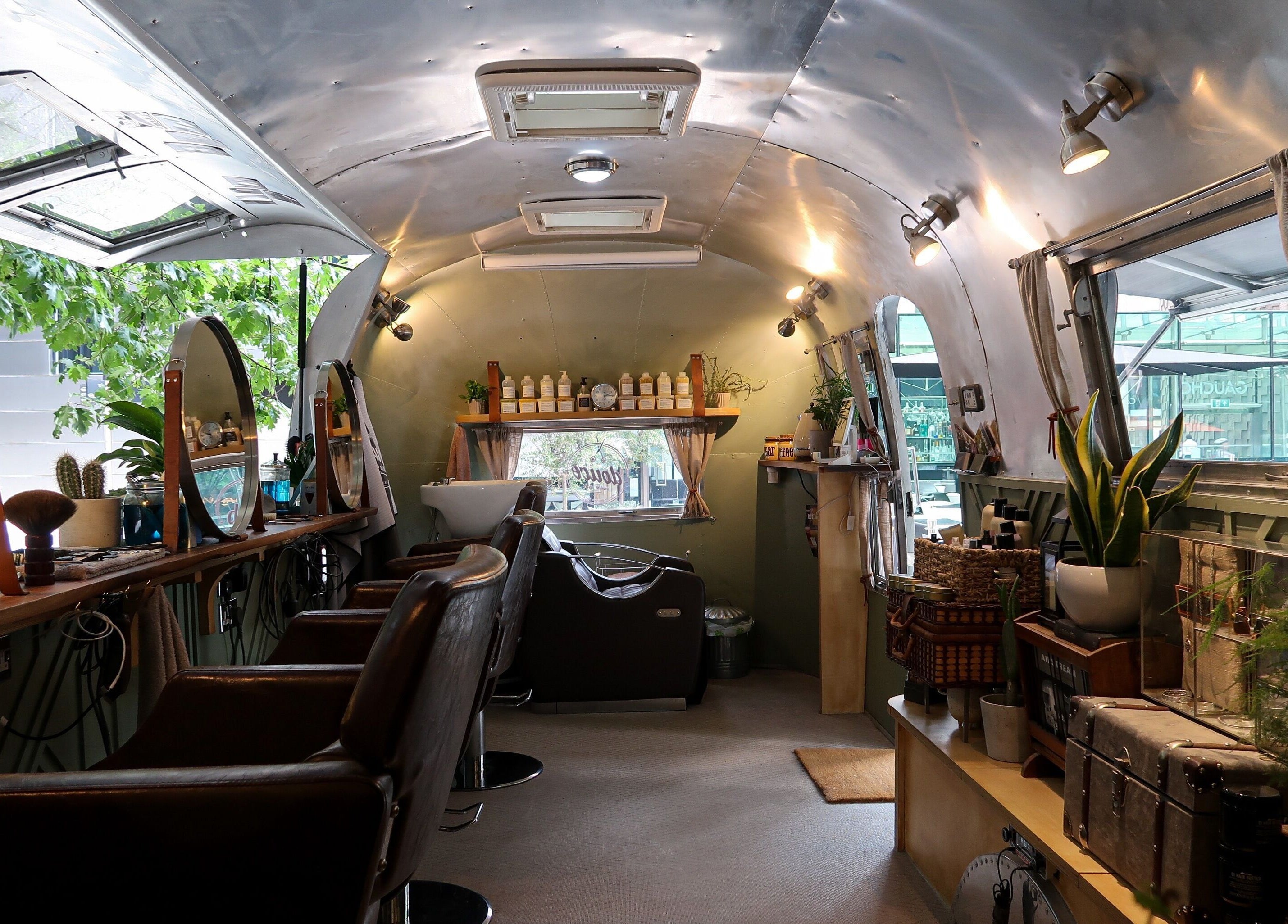 Inside Douce Shoreditch, an Airstream salon at London, England, GB offering vintage charm and wellness services.