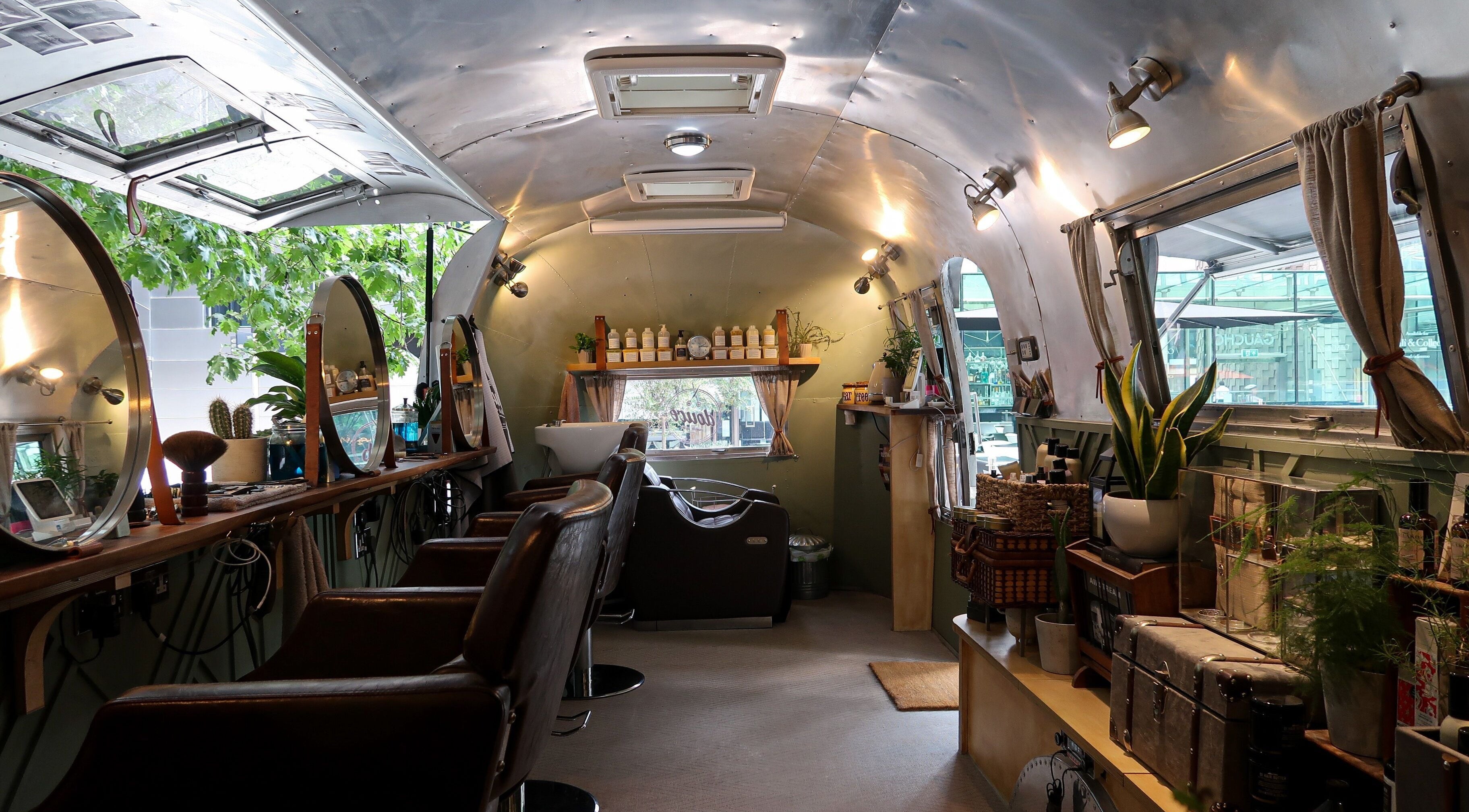 Inside Douce Shoreditch, an Airstream salon at London, England, GB offering vintage charm and wellness services.
