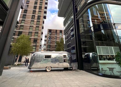 Mobile salon at Douce Shoreditch in London, England, GB amidst modern architecture.