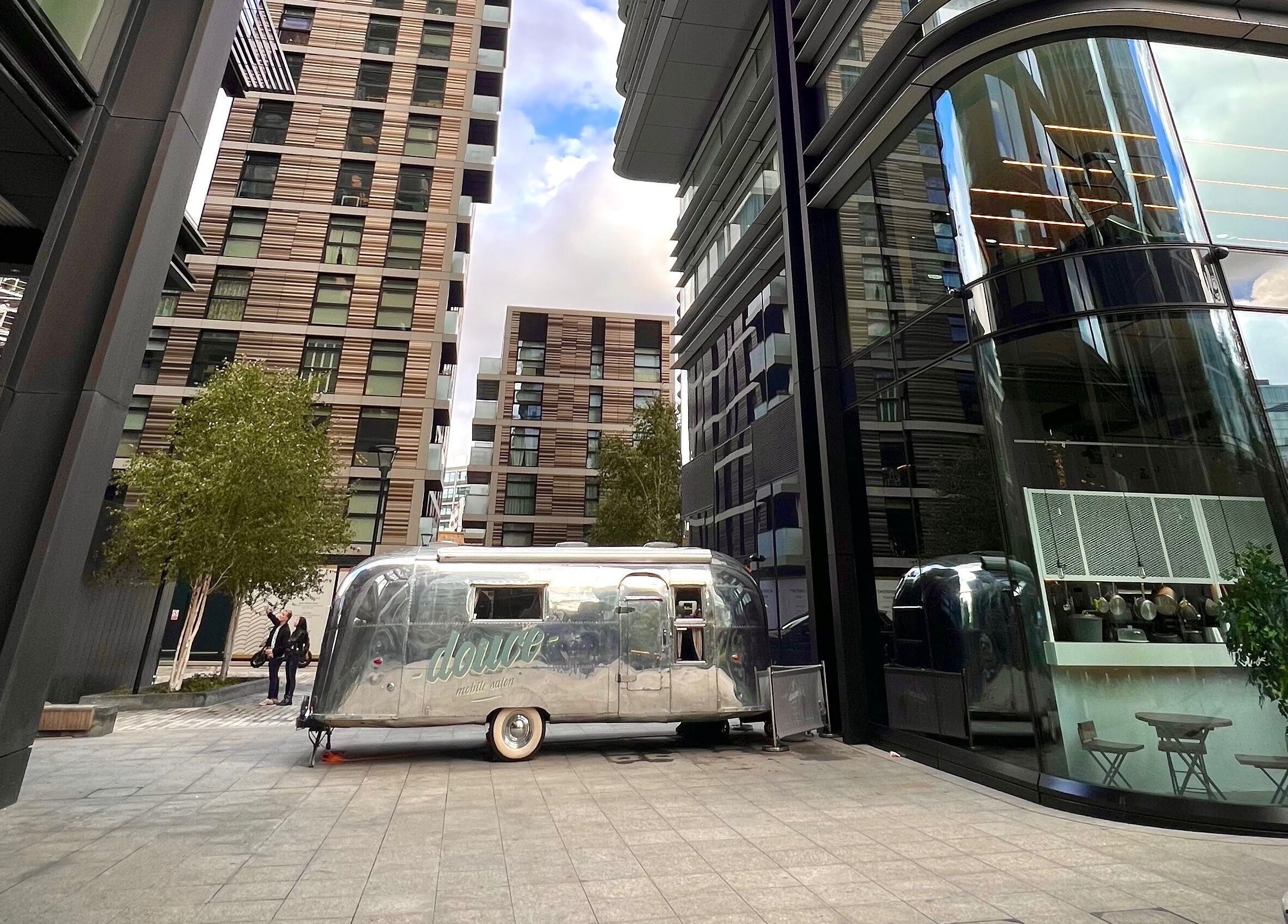 Mobile salon at Douce Shoreditch in London, England, GB amidst modern architecture.