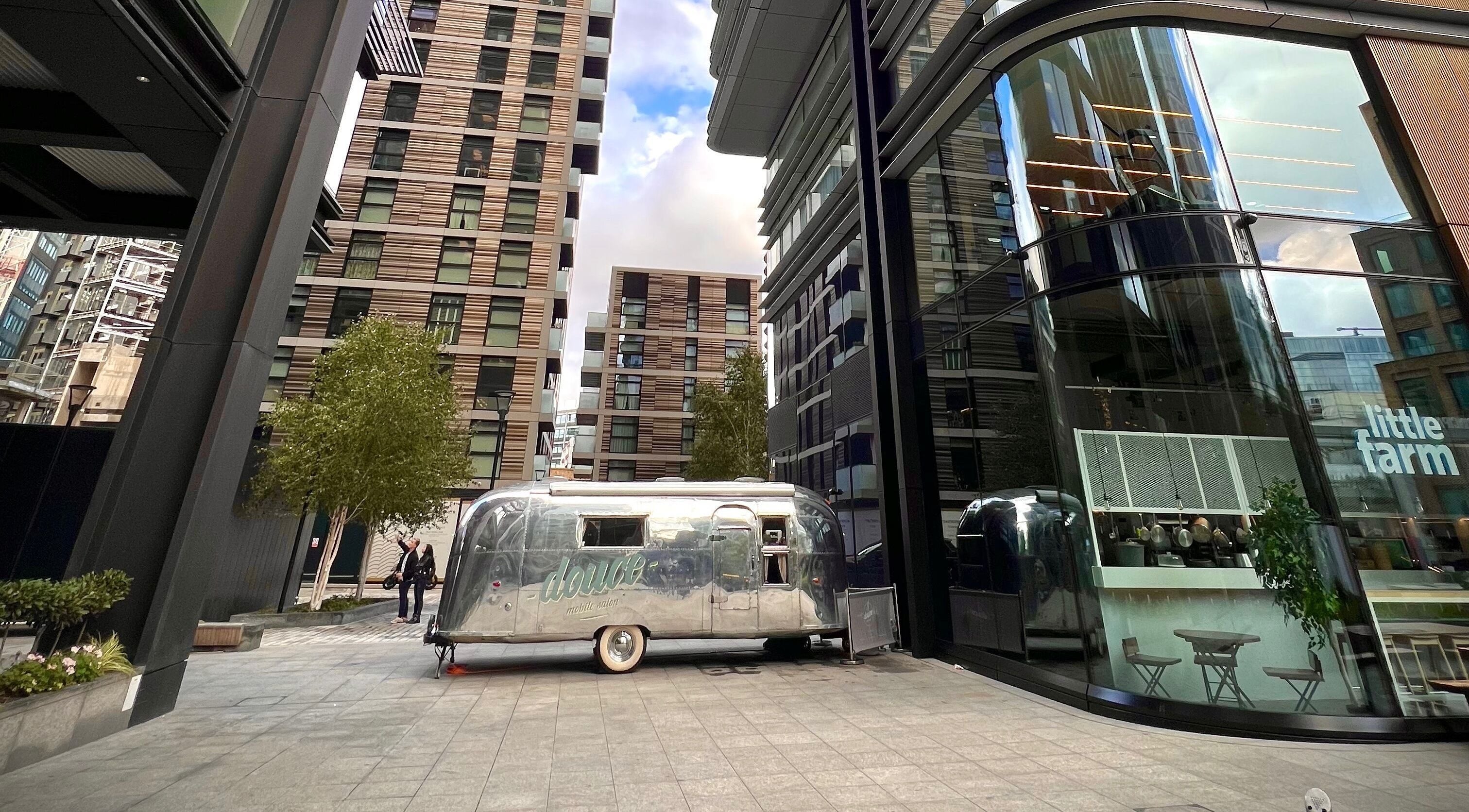 Mobile salon at Douce Shoreditch in London, England, GB amidst modern architecture.