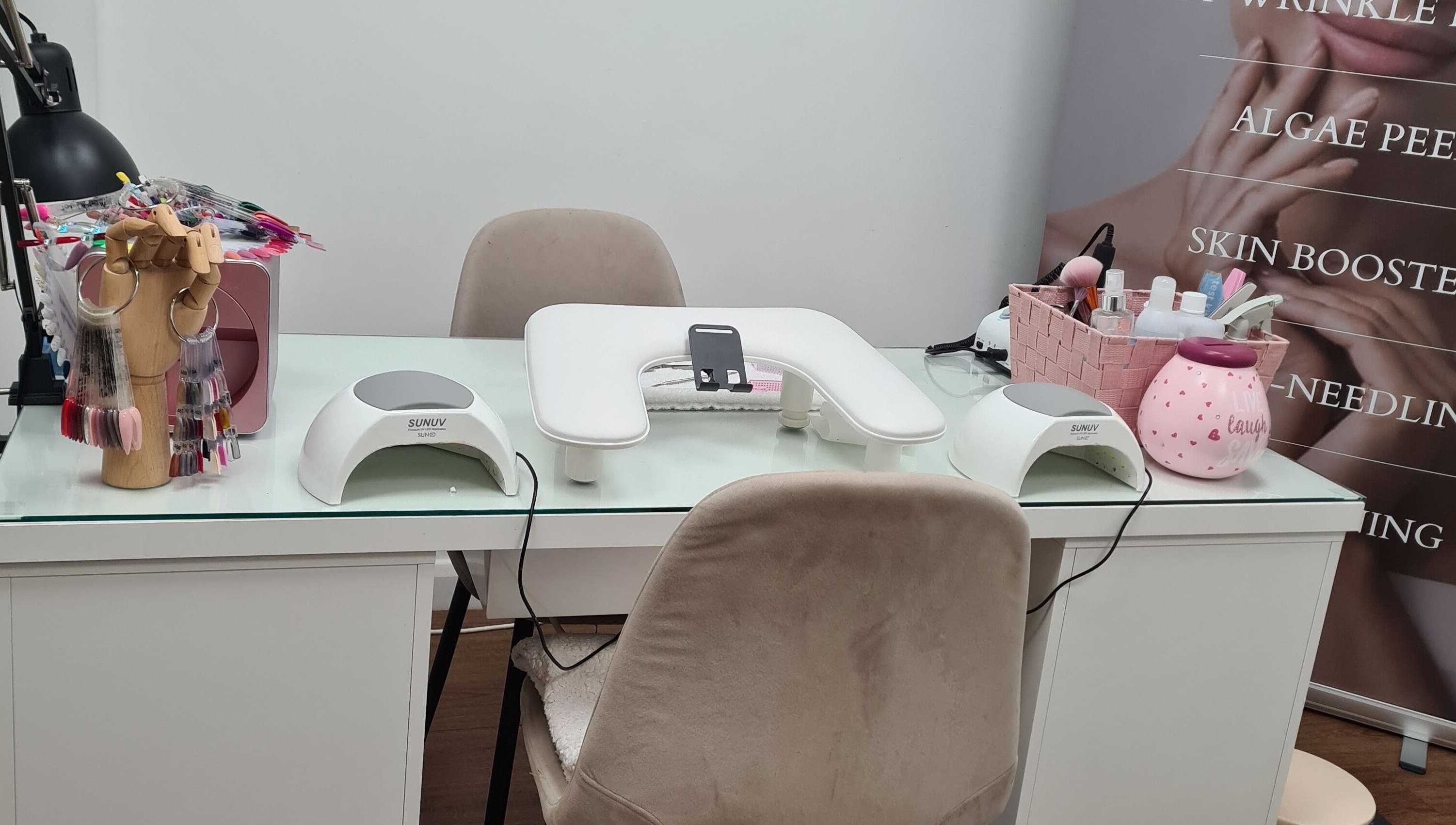 Manicure setup at Avc beauty Castle Aesthetics in Colchester, England, GB featuring nail tools and UV lamps.
