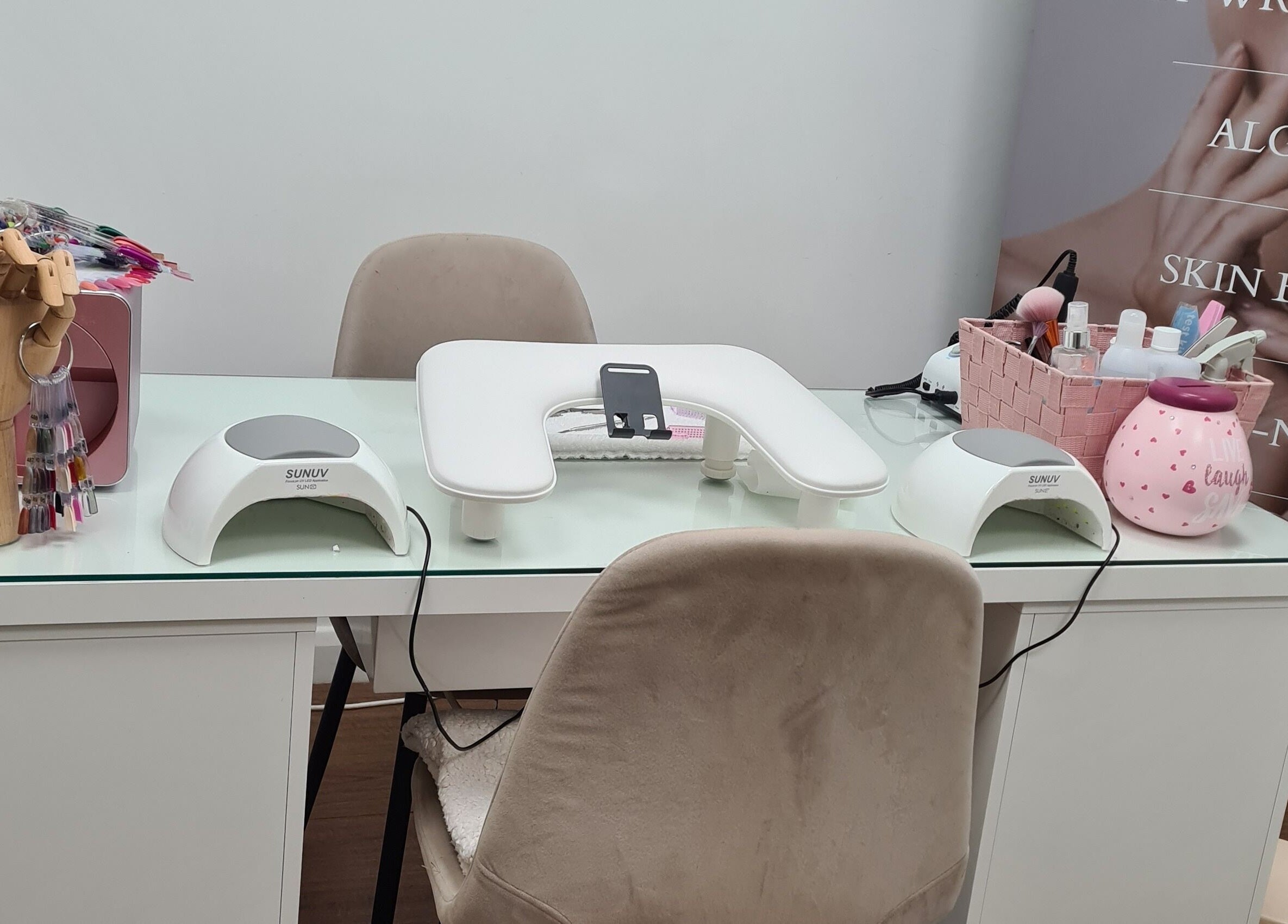 Manicure setup at Avc beauty Castle Aesthetics in Colchester, England, GB featuring nail tools and UV lamps.