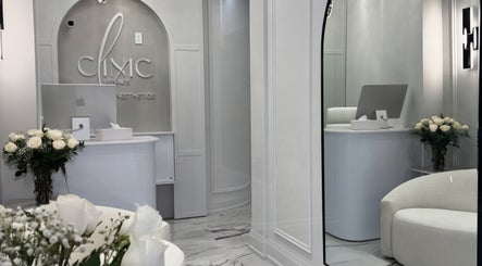 Elegant reception area at Aesthetic Nurse Marta in Vaughan, Ontario, CA with chic decor and white flowers.