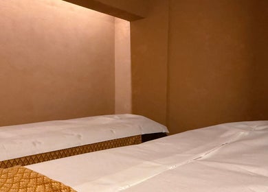 Calming massage room at OPULENCE THAI SPA | Covent Garden, London, England, GB with two beds for relaxation.