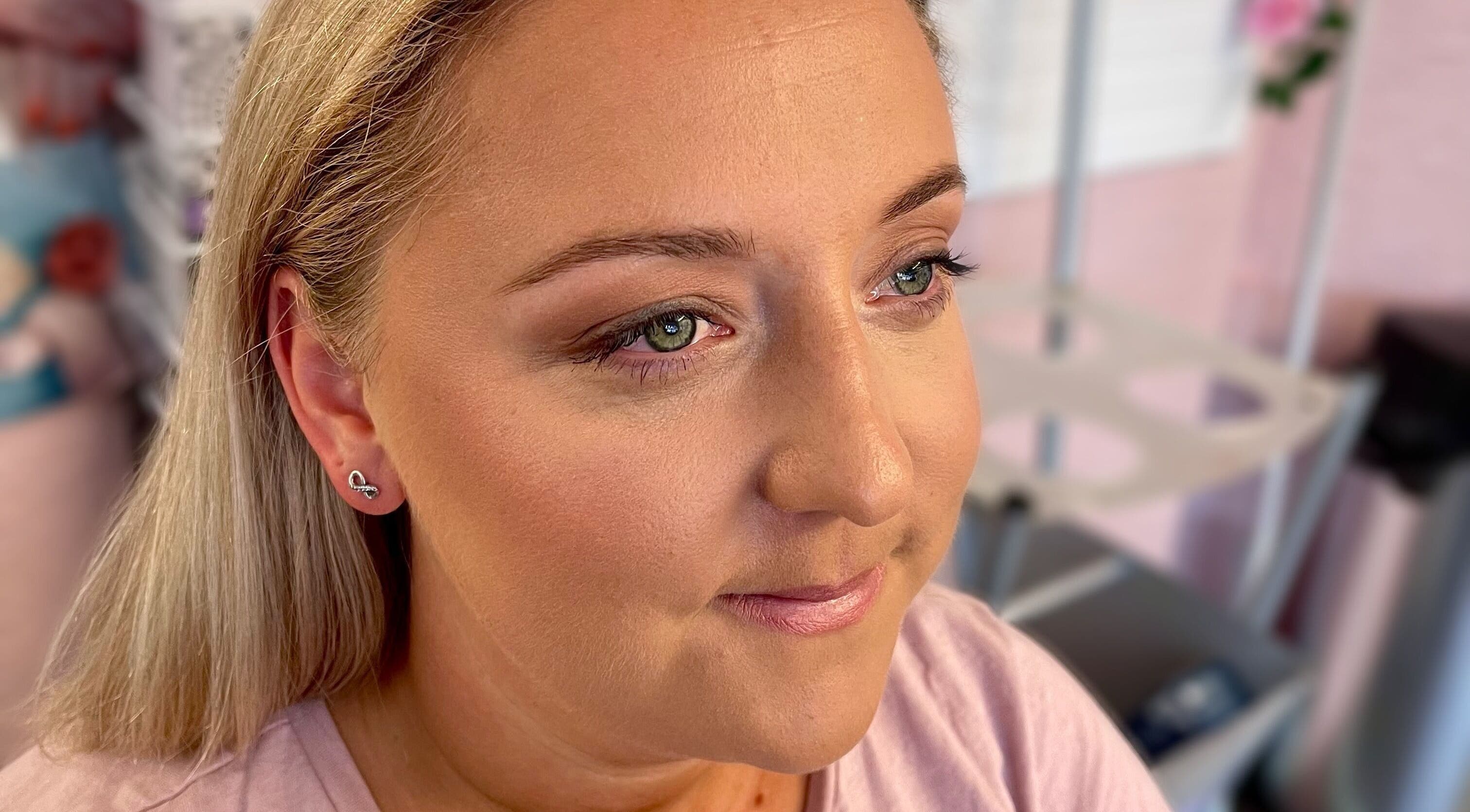 Client with radiant makeup at Michaela Hearne Beauty, Forest Town, England, GB showing natural elegance.