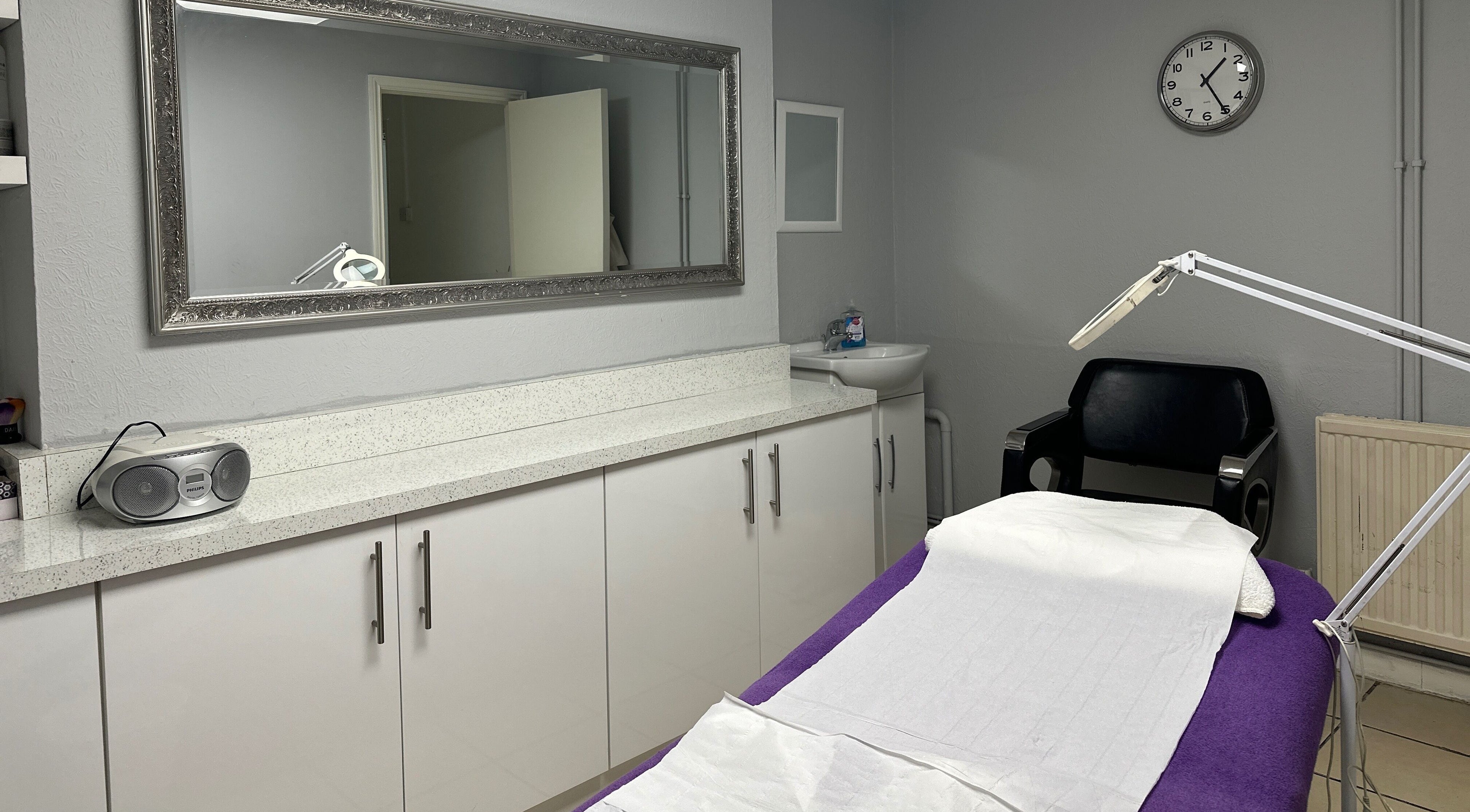 Relaxing treatment room at PB Beauty Studio, London, England, GB, showcasing a tranquil setting with a treatment bed.