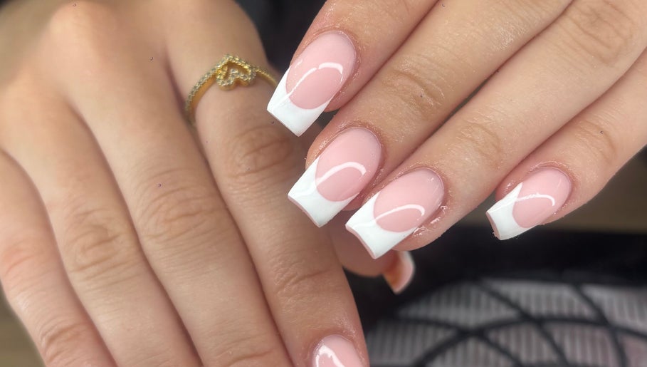 Elegant French manicure nails at Nails by Lily, Llansamlet, Cymru, GB showcasing stylish pink and white design.