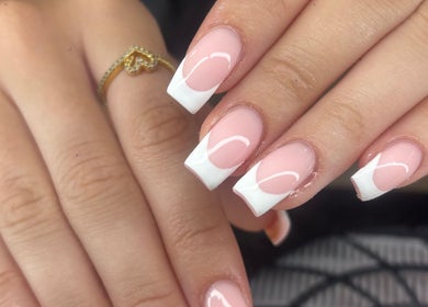 Elegant French manicure nails at Nails by Lily, Llansamlet, Cymru, GB showcasing stylish pink and white design.