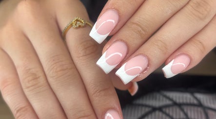Elegant French manicure nails at Nails by Lily, Llansamlet, Cymru, GB showcasing stylish pink and white design.