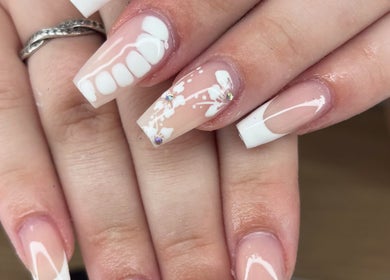 Elegant floral nail art at Nails by Lily, Llansamlet, Cymru, GB showcasing delicate designs with rhinestones.