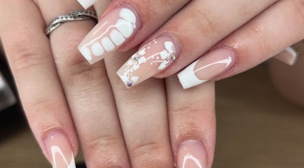 Elegant floral nail art at Nails by Lily, Llansamlet, Cymru, GB showcasing delicate designs with rhinestones.