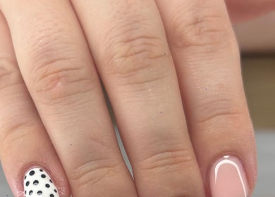 Polka dot and pink manicure by Nails by Lily in Llansamlet, Cymru, GB, showcasing elegant nail art.