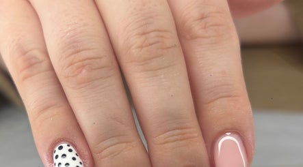 Polka dot and pink manicure by Nails by Lily in Llansamlet, Cymru, GB, showcasing elegant nail art.