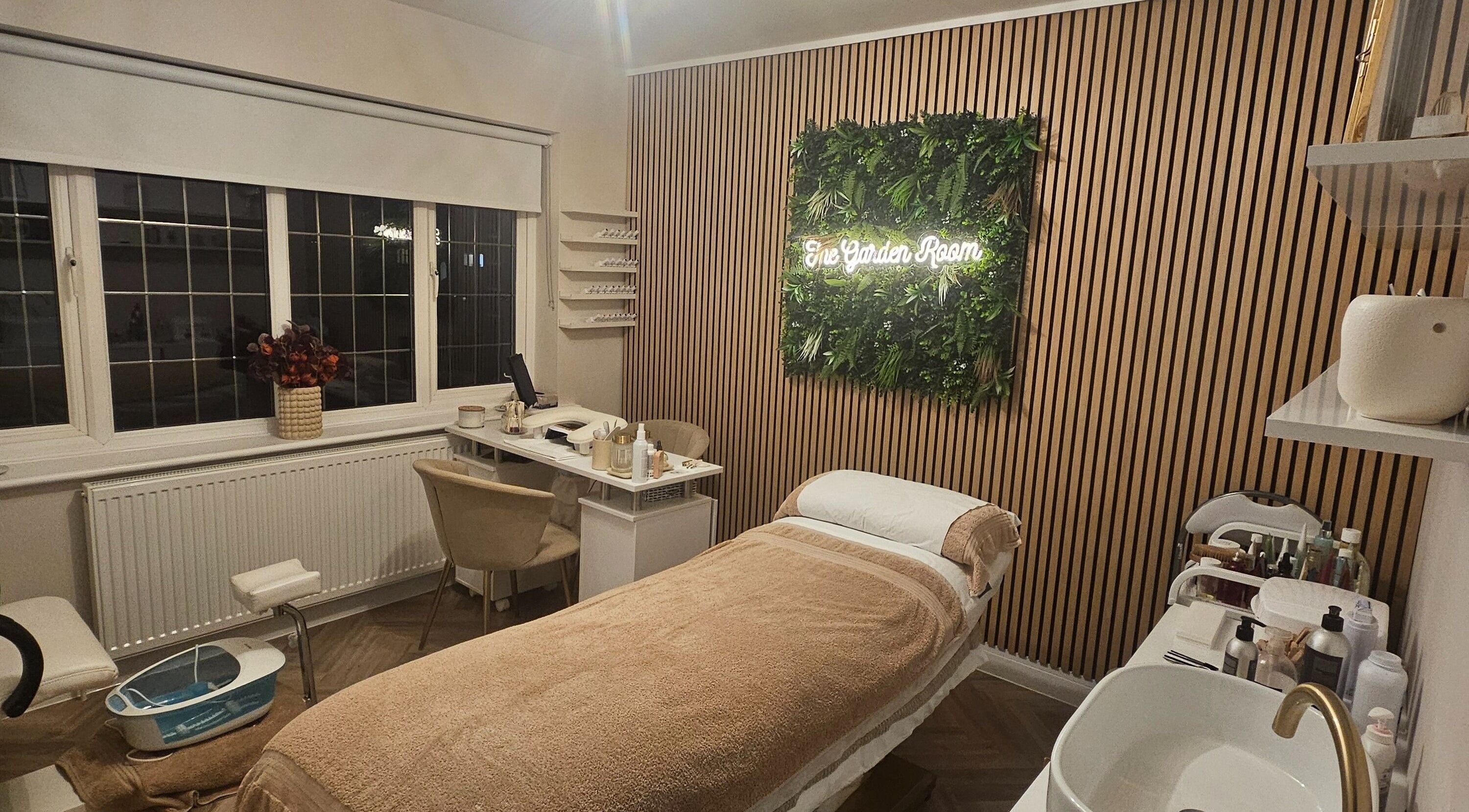 Relaxing treatment room at The Garden Room, Havant, England, GB with elegant decor and a treatment bed.