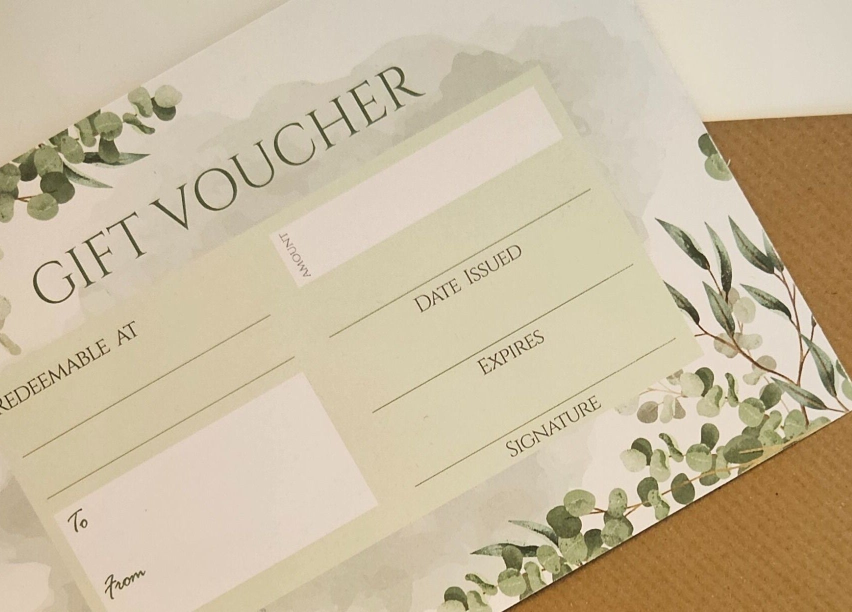 Gift voucher for The Garden Room, Havant, England, GB with green foliage design, ready to personalize.