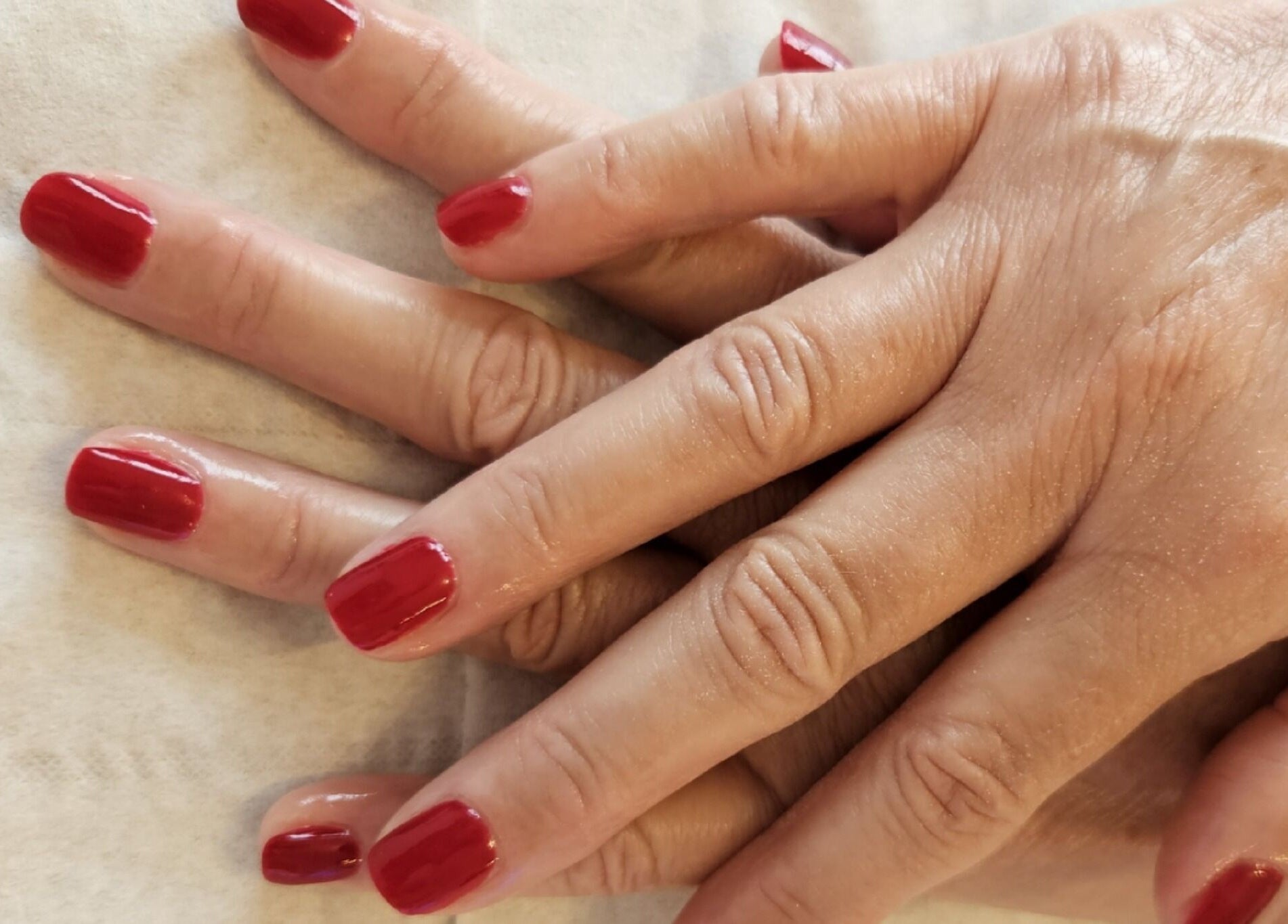 Freshly manicured nails with red polish at The Garden Room, Havant, England, GB.