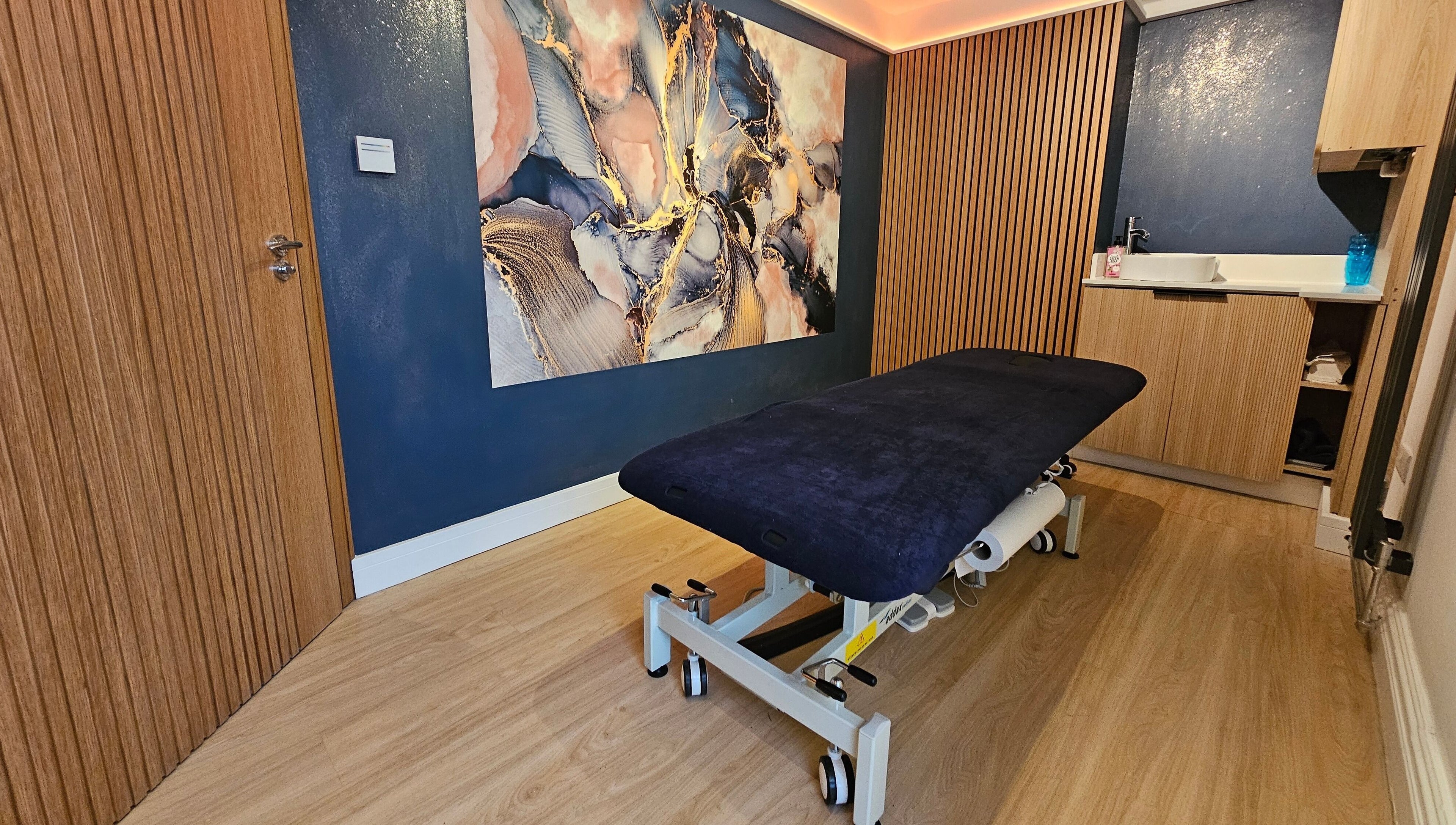 Stylish therapy room at Equilize Holistic Therapies, Wadhurst, England, GB with elegant decor and massage table.