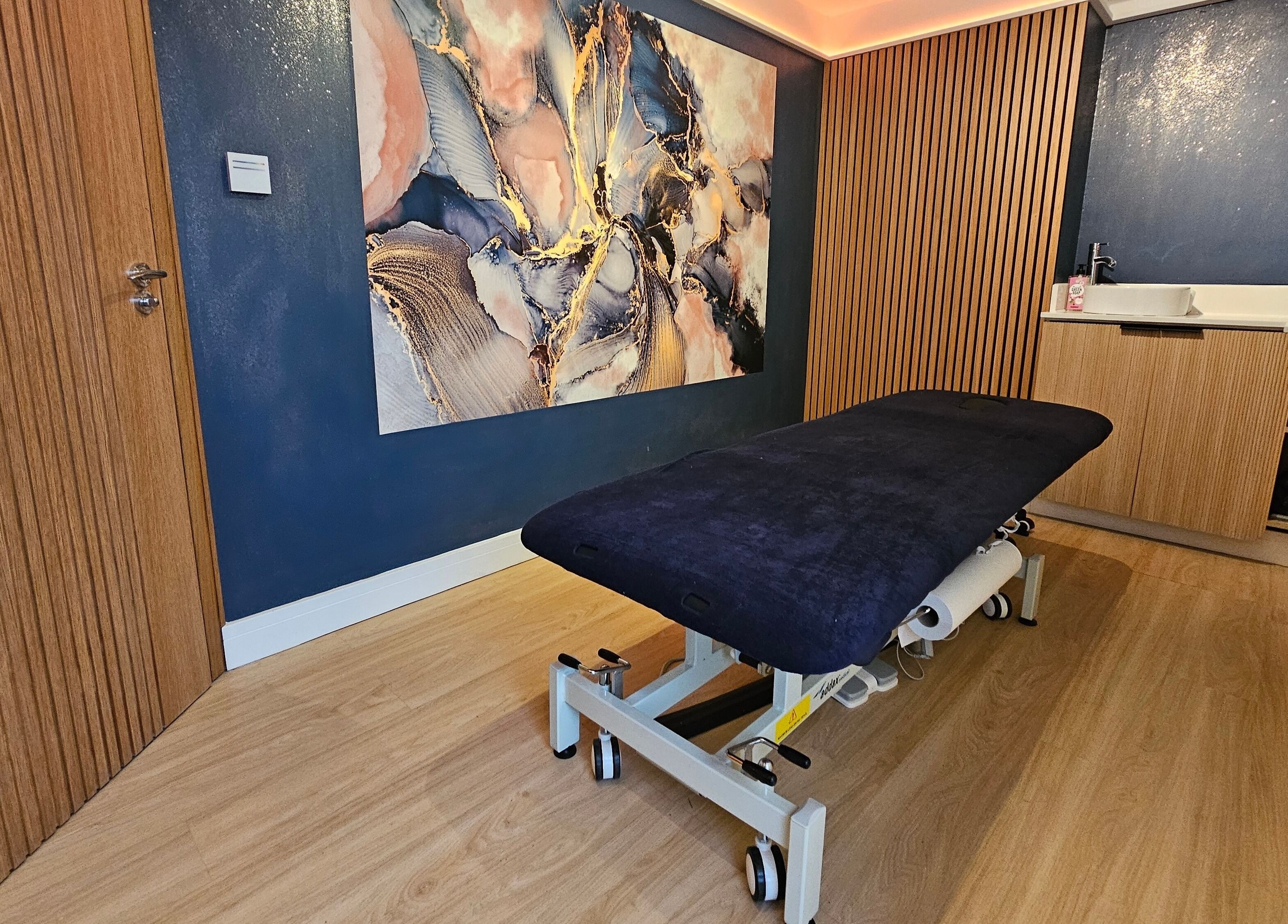 Stylish therapy room at Equilize Holistic Therapies, Wadhurst, England, GB with elegant decor and massage table.