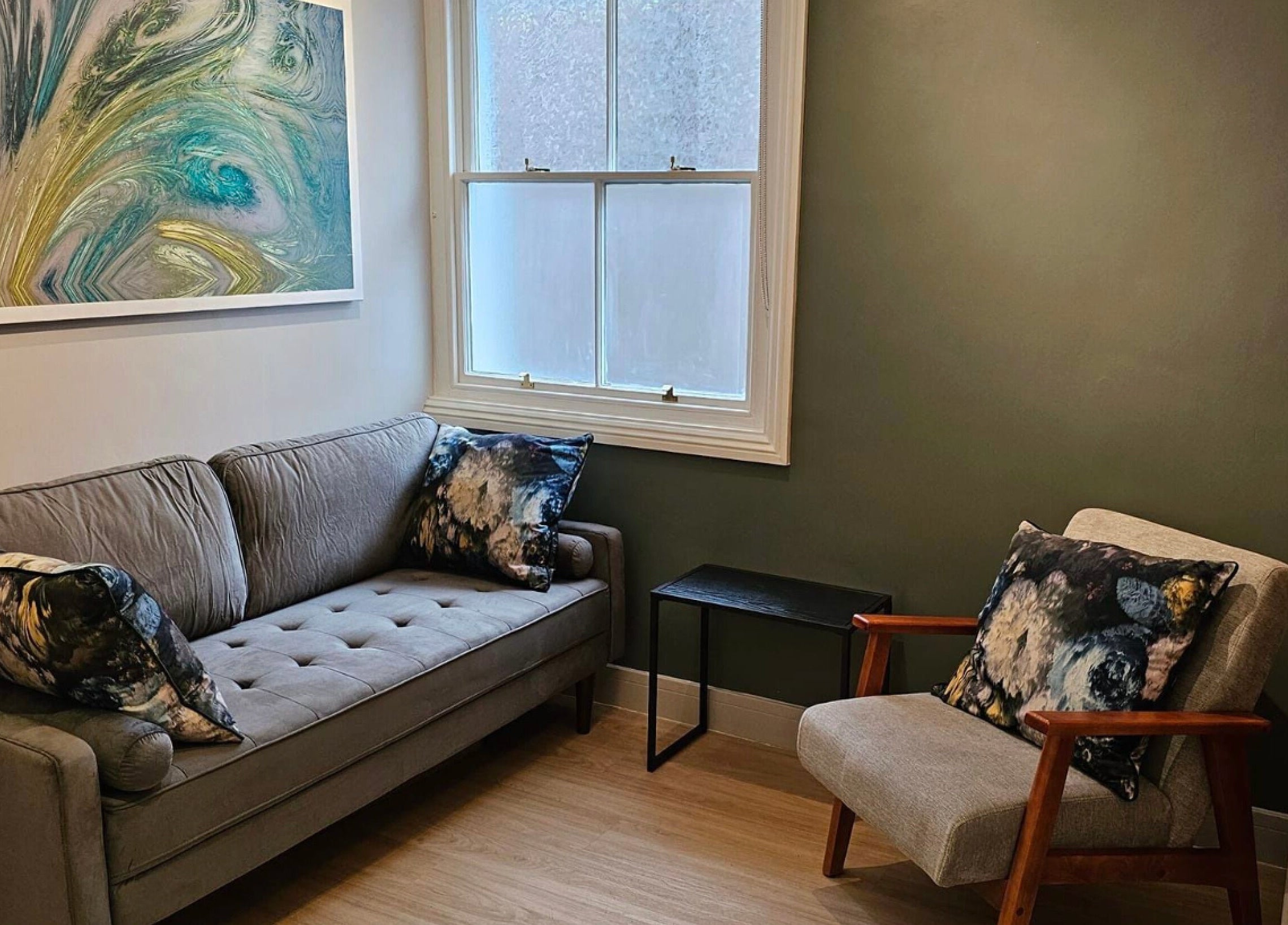 Cozy seating area with abstract art at Equilize Holistic Therapies, Wadhurst, England, GB.