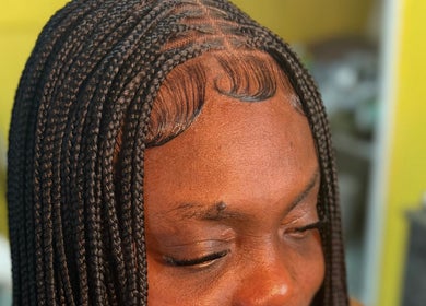 Intricate braided hairstyle at Goldy Mane Collection, Miami, Florida, US.