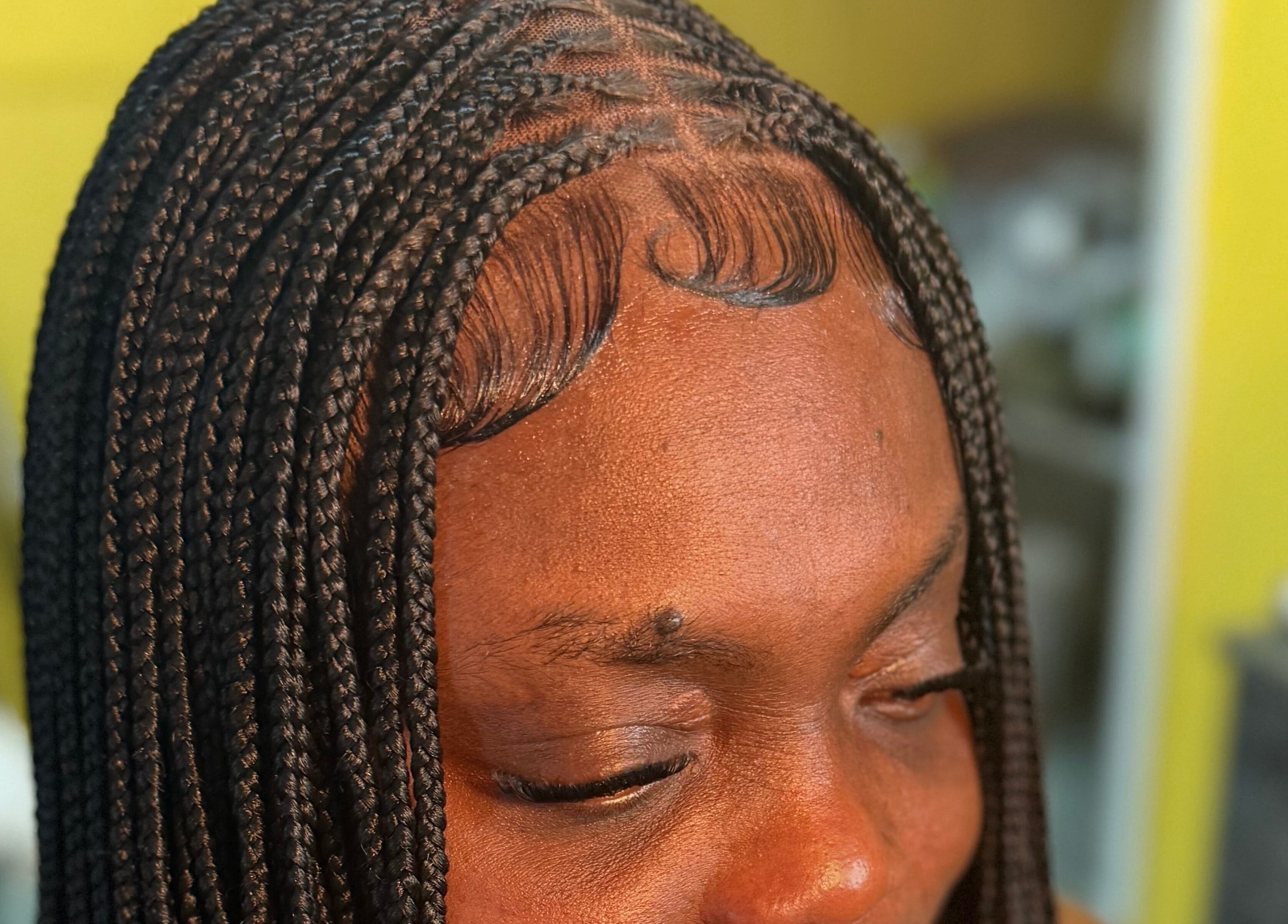 Intricate braided hairstyle at Goldy Mane Collection, Miami, Florida, US.