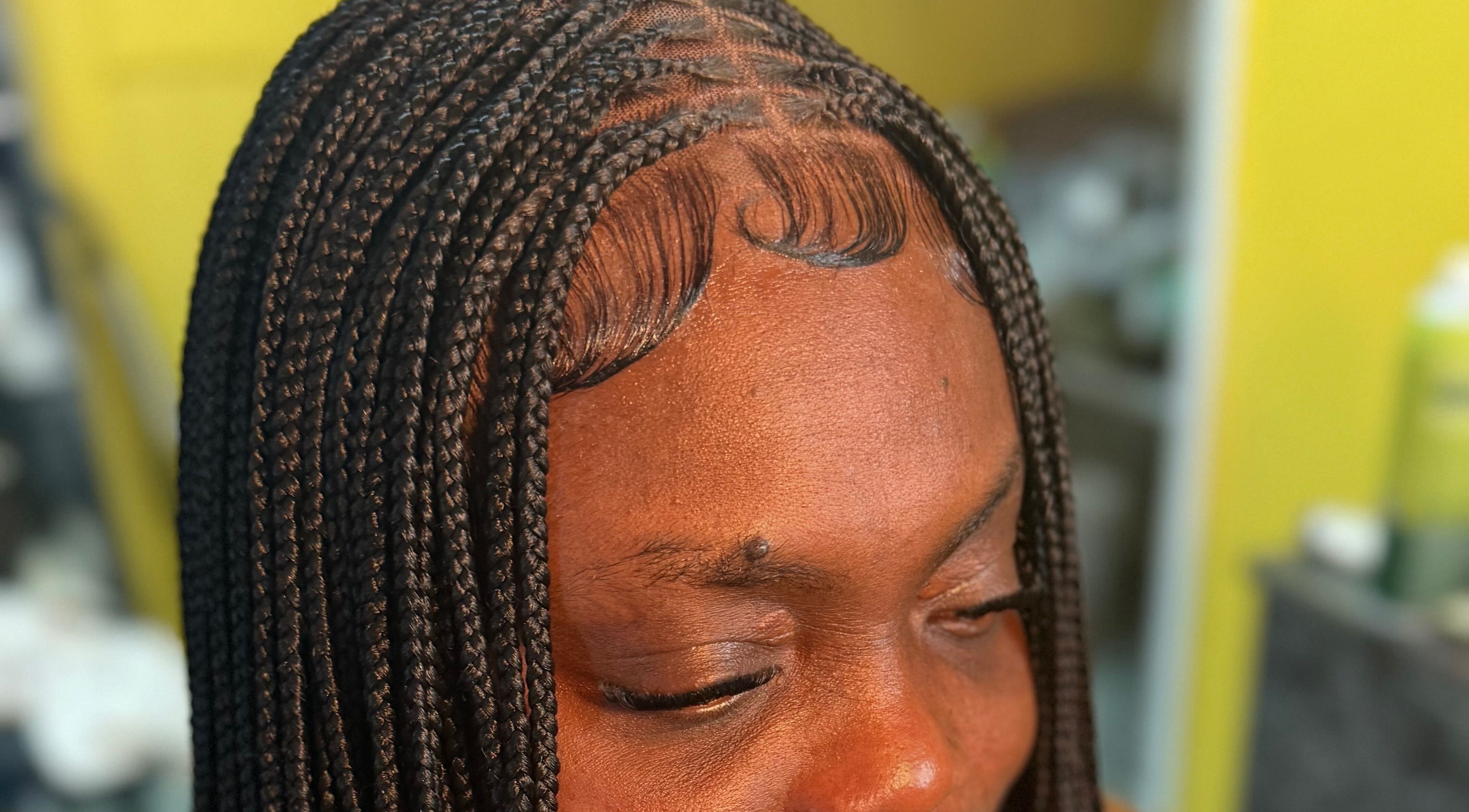 Intricate braided hairstyle at Goldy Mane Collection, Miami, Florida, US.