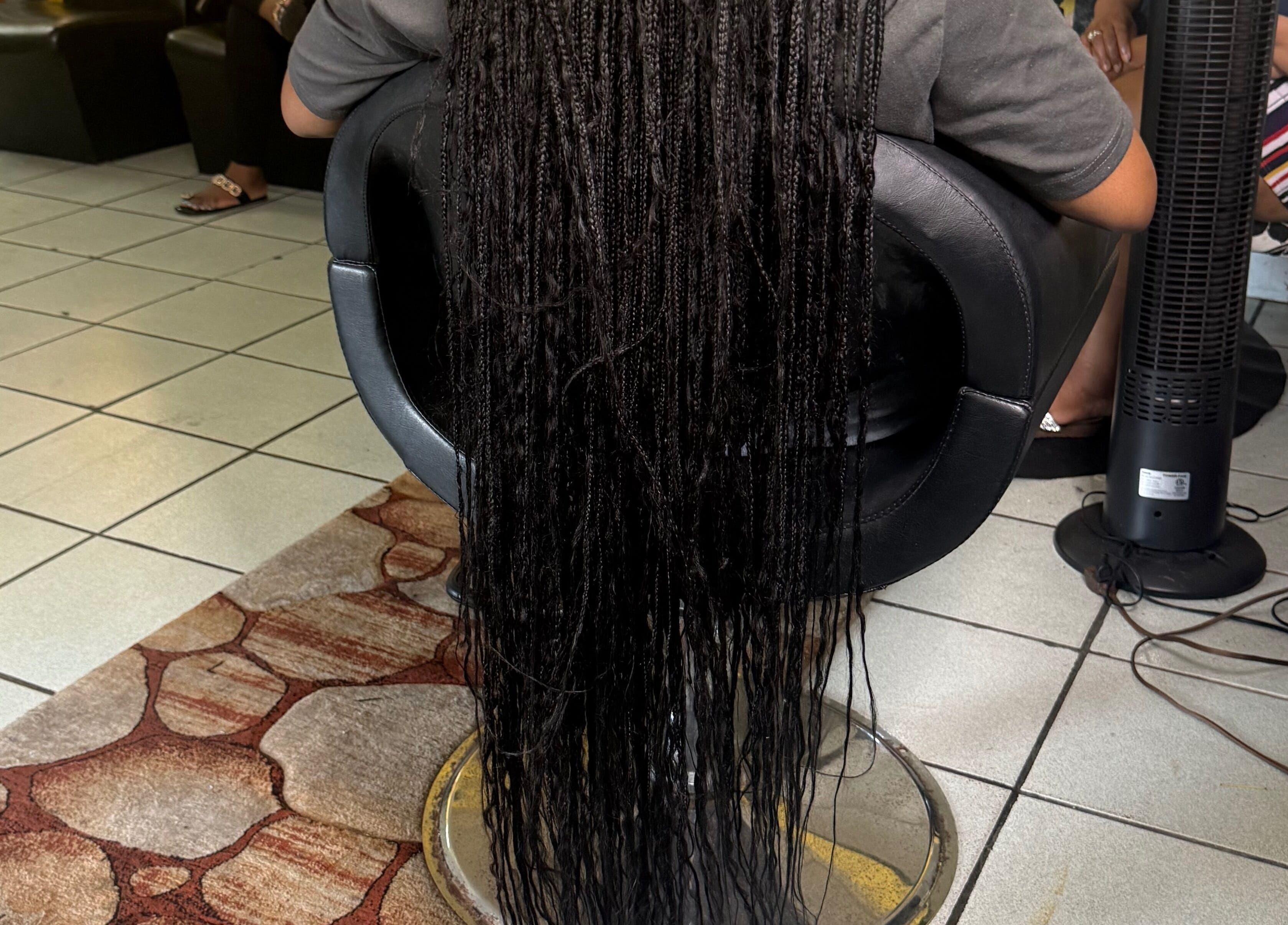 Intricate braids at Goldy Mane Collection, Miami, Florida, US, showcasing expert hair styling.