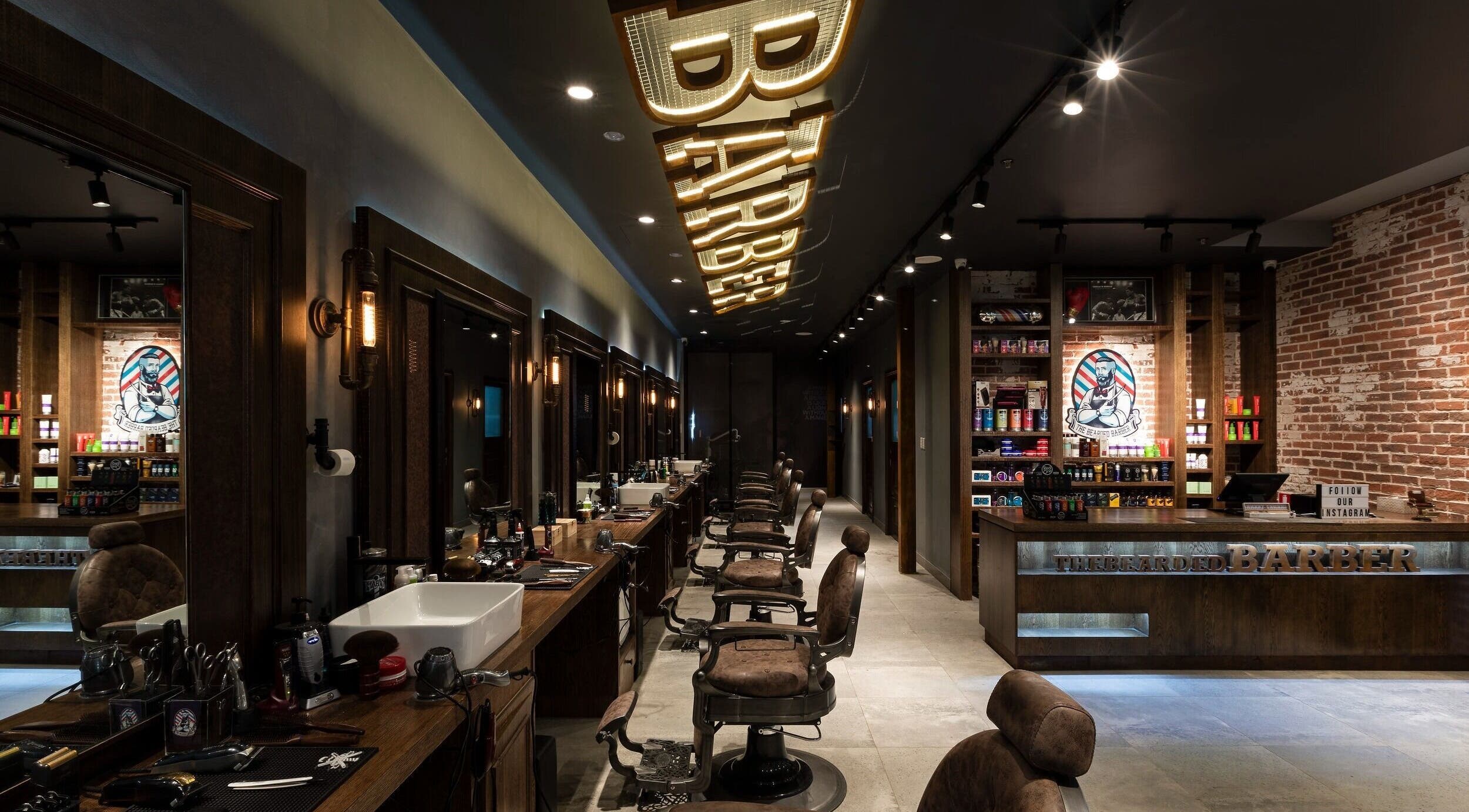 Interior of The Bearded Barber Miranda in New South Wales, AU with classic barber chairs and sleek decor.