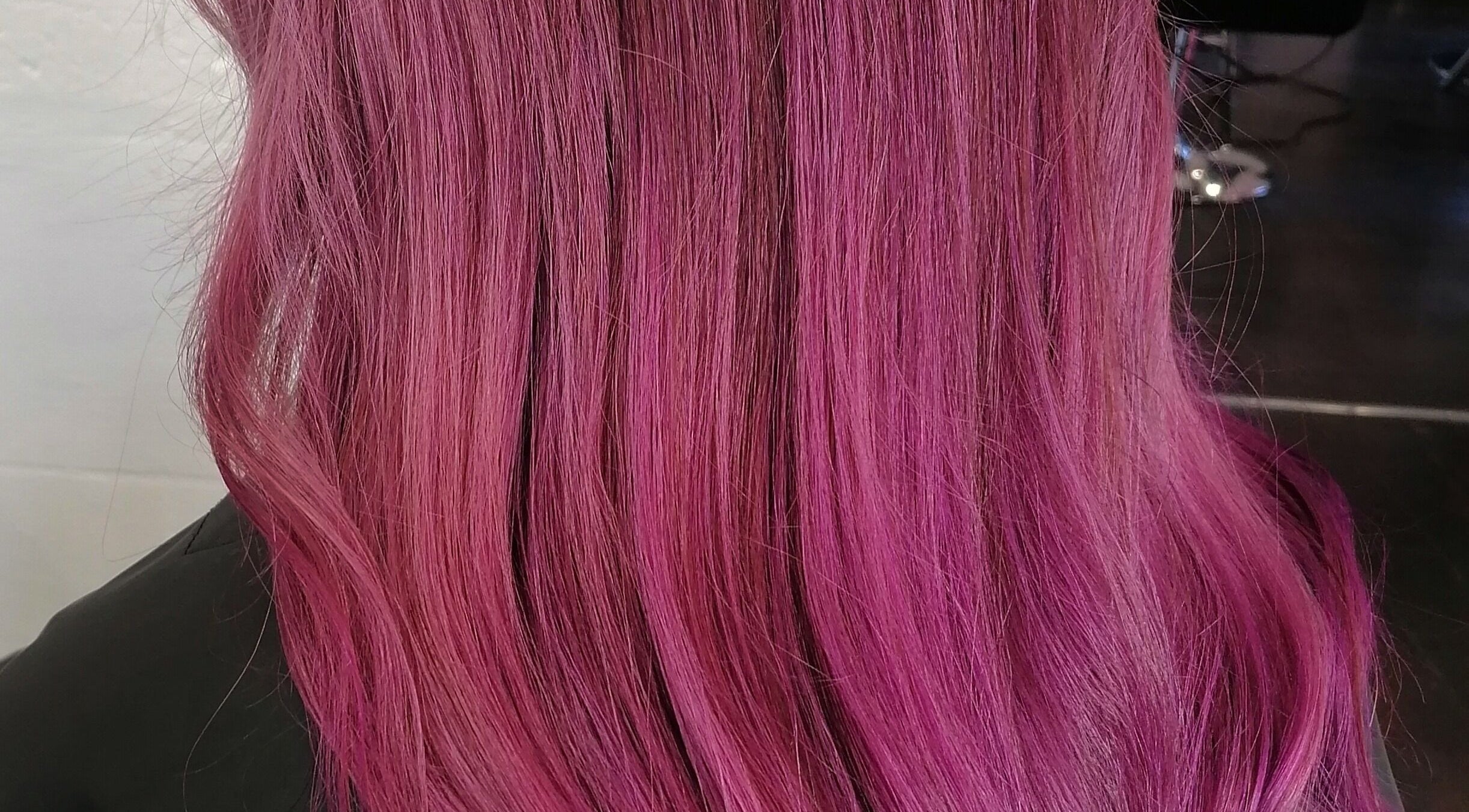 Vibrant pink hair styled by Hair by Nicola Smit, located in Pretoria, Gauteng, ZA.