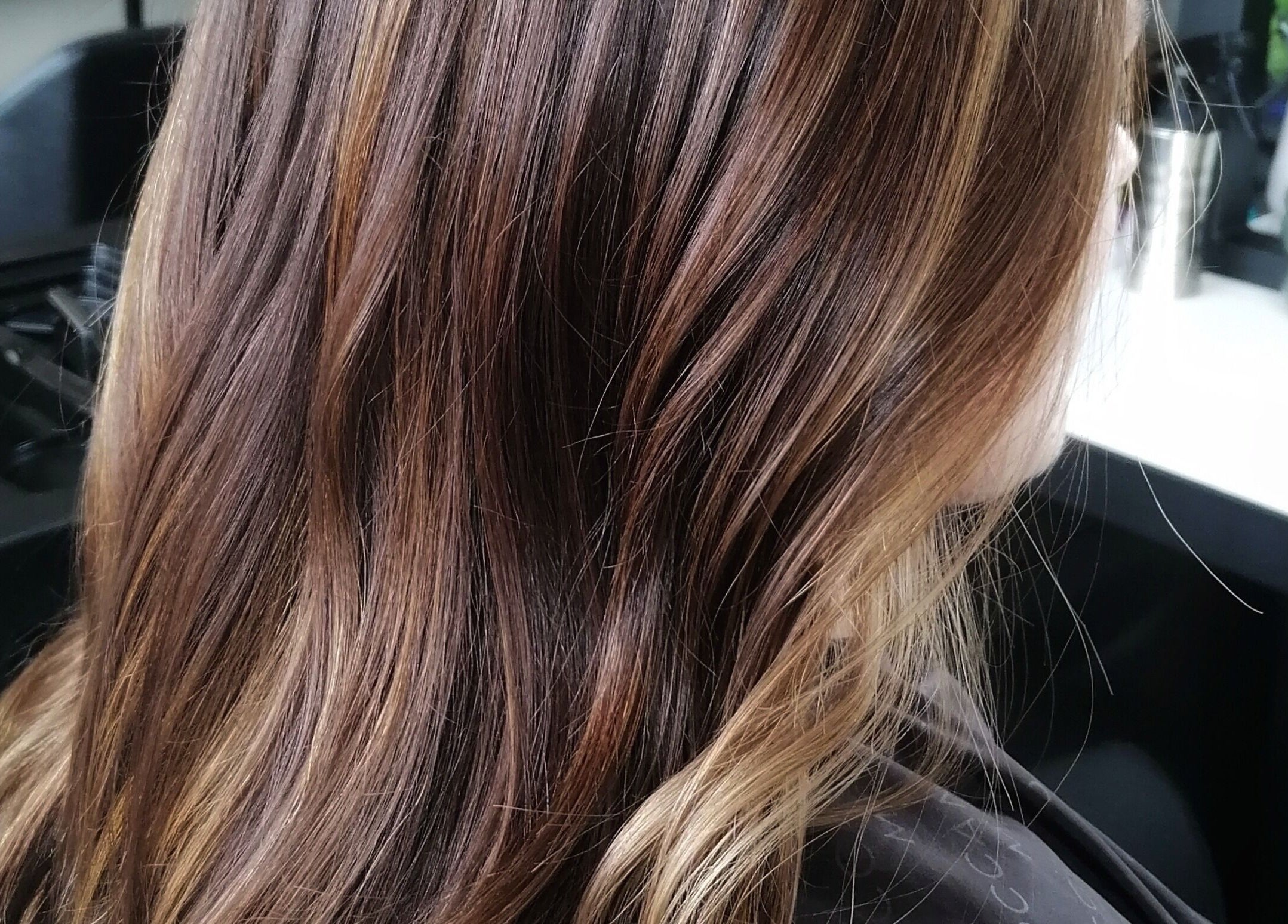 Rich brown highlights at Hair by Nicola Smit, Pretoria, Gauteng, ZA, showcasing expert hair coloring.