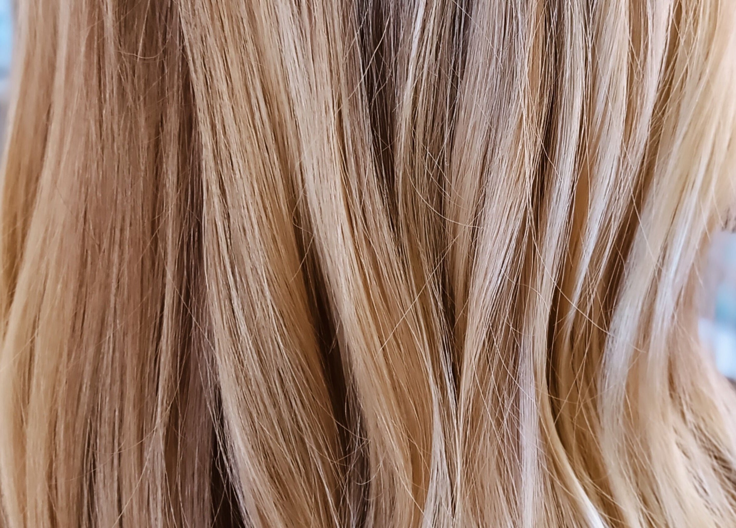 Close-up of beautifully styled blonde hair at Hair by Nicola Smit, Pretoria, Gauteng, ZA.