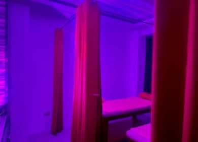 Tranquil massage room with purple lighting at Caelum Massage Spa And Sauna Wellness Center, Bacoor, Calabarzon, PH.