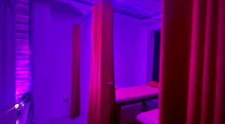 Tranquil massage room with purple lighting at Caelum Massage Spa And Sauna Wellness Center, Bacoor, Calabarzon, PH.