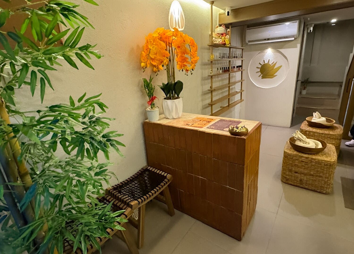 Cozy lobby area of Bamboo Spa Beauty and Wellness BGC in Taguig, Metro Manila, PH with bamboo decor and seating.