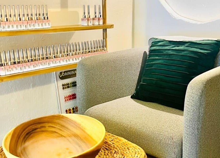Relaxing seating area at Bamboo Spa Beauty and Wellness BGC, Taguig, Metro Manila, PH with nail polish display.