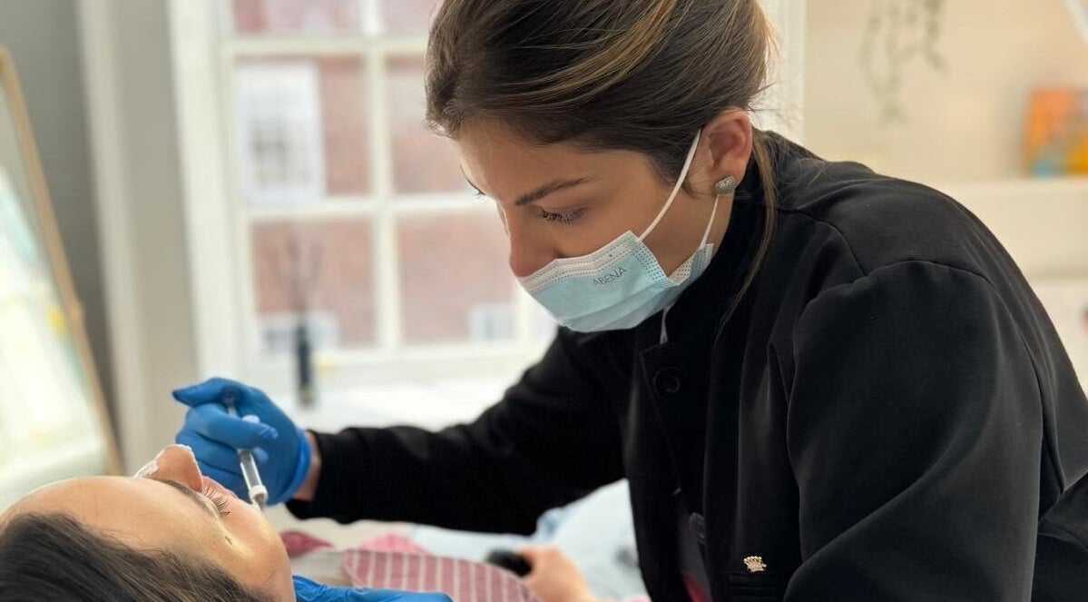 Skilled practitioner at Dermal Care Clinic, Dublin, providing facial treatment with precision.