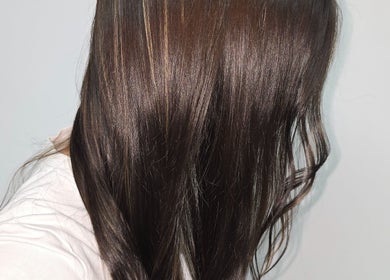 Elegant brown hair shine at AR Hair, Bathgate, Scotland, GB reflecting expert care and styling.