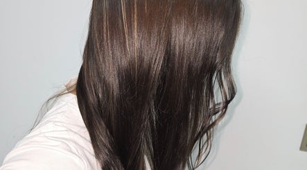 Elegant brown hair shine at AR Hair, Bathgate, Scotland, GB reflecting expert care and styling.