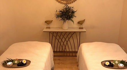 Relaxing massage room at Cheewa Aroma Remedial Thai, Melbourne, Victoria, AU with two massage tables.