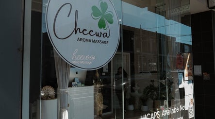 Front window of Cheewa Aroma Remedial Thai in Melbourne, Victoria, AU showcasing elegant decor and signage.