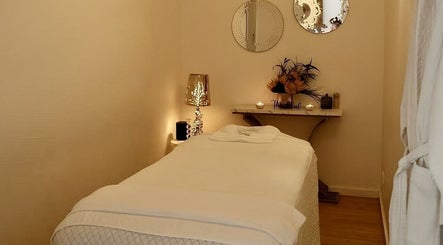 Relaxing massage room at Cheewa Aroma Remedial Thai in Melbourne, Victoria, AU, with cozy and inviting decor.